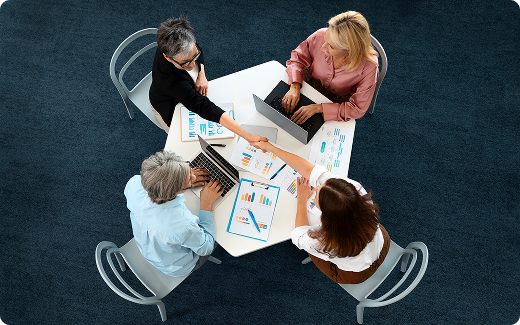 Top-down view of a team collaborating around a table